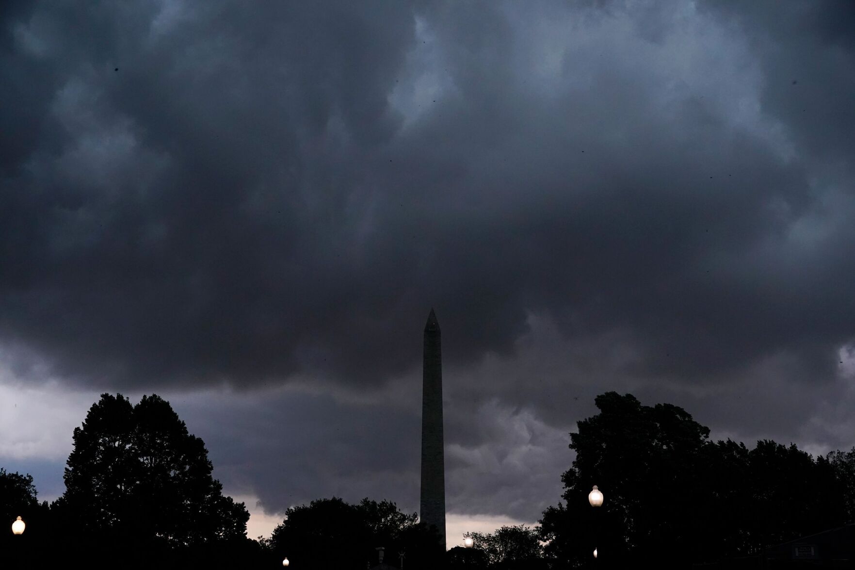Tens of thousands still without power after deadly storms as a new wave of severe weather and flooding hits